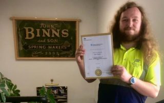 Sam with his Apprenticeship Completion Certificate